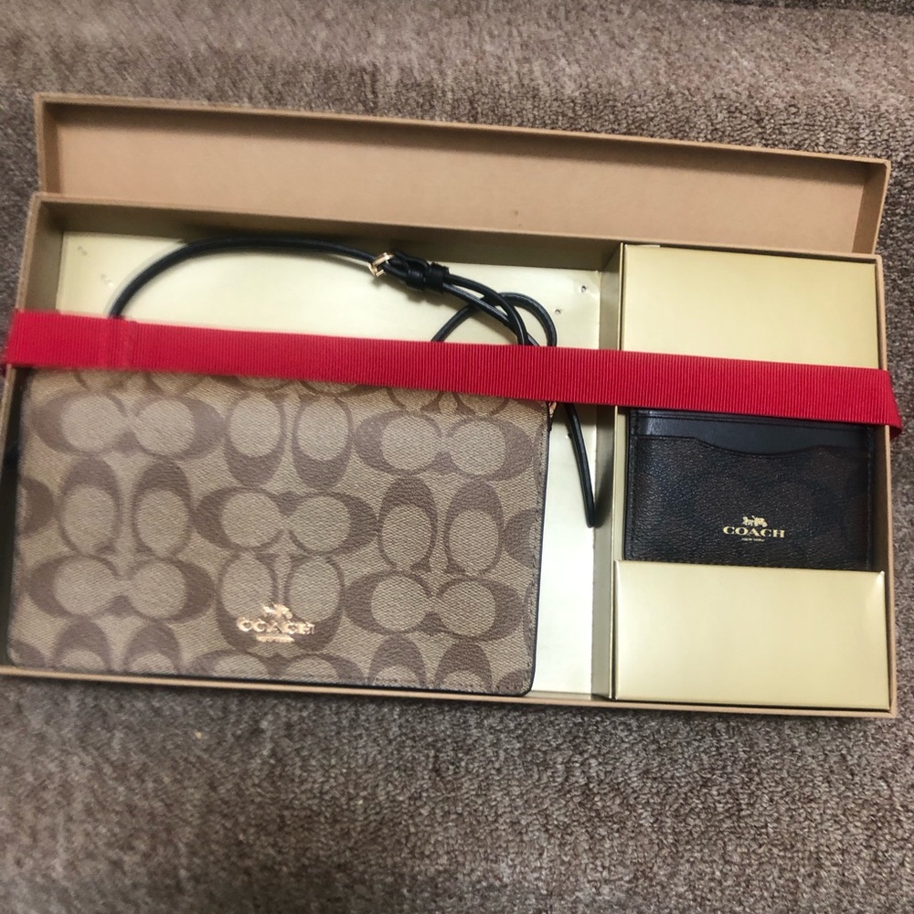 A COACH crossbody wallet